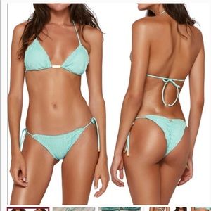 Beautiful bikini. Brand new. Top is large. Bottom is a Brazilian cut small.